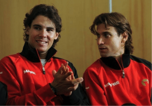 Rafael Nadal and David Ferrer sitting at press conference clapping